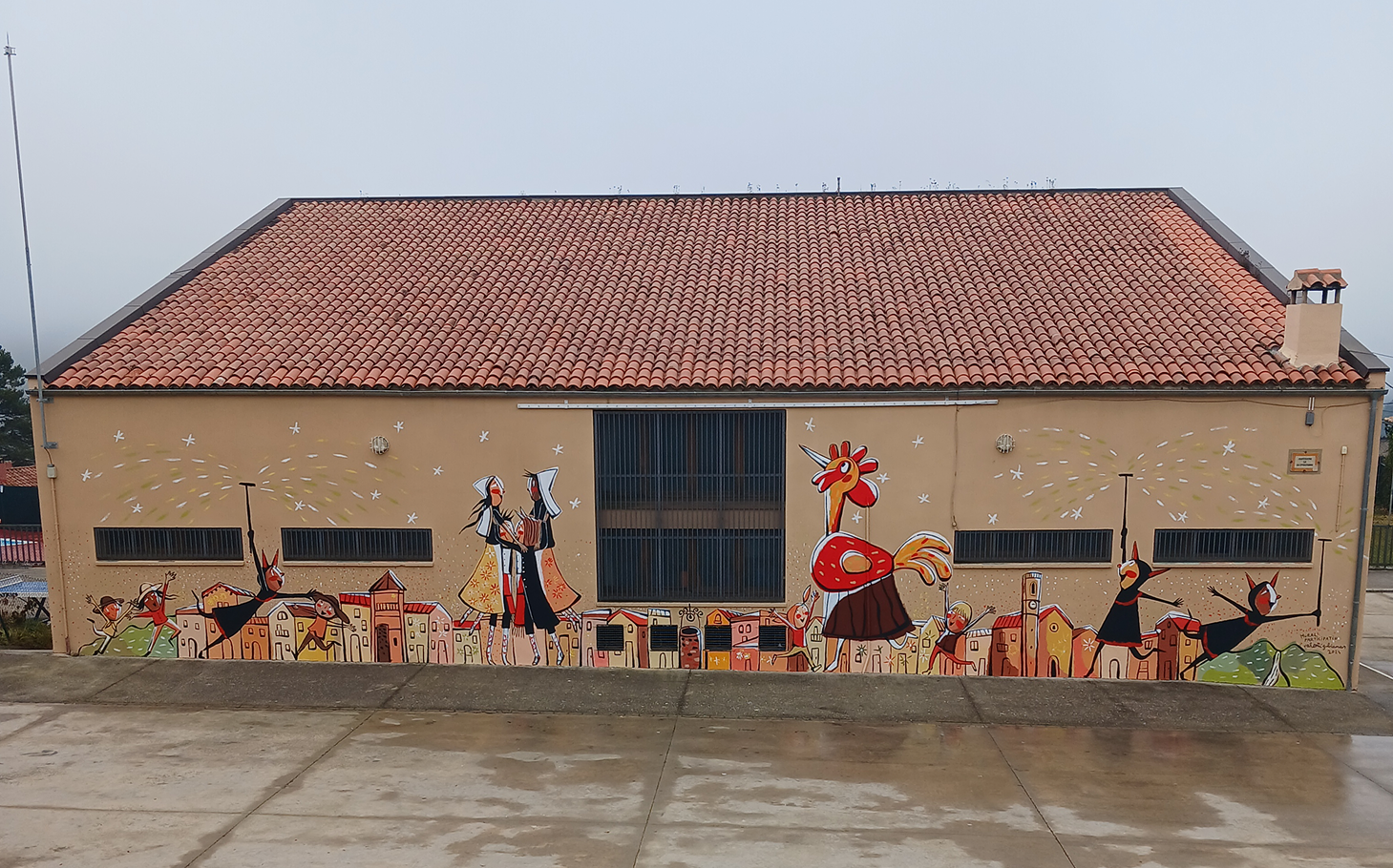 El nucli del poble, els Dimonis socarrimats, el Ballet i Corranda de Borredà i el Gall Radulf han quedat plasmats a l'escola