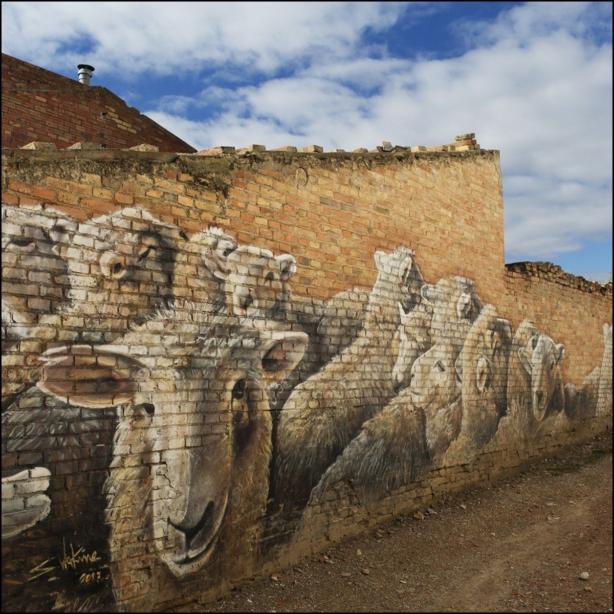 El mural en el que es veu un ramat d'ovelles