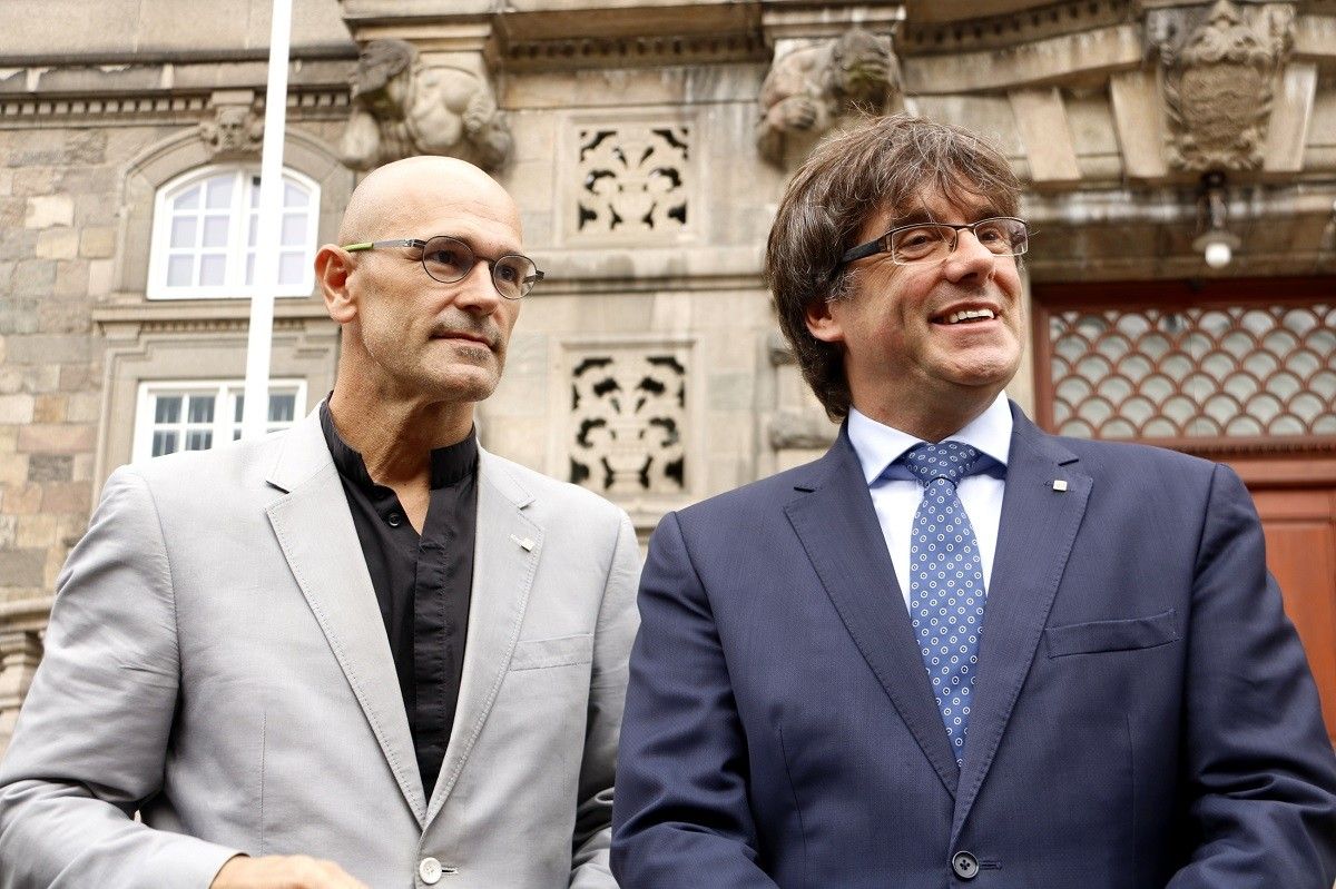 Carles Puigdemont i Raül Romeva, en una imatge d'arxiu