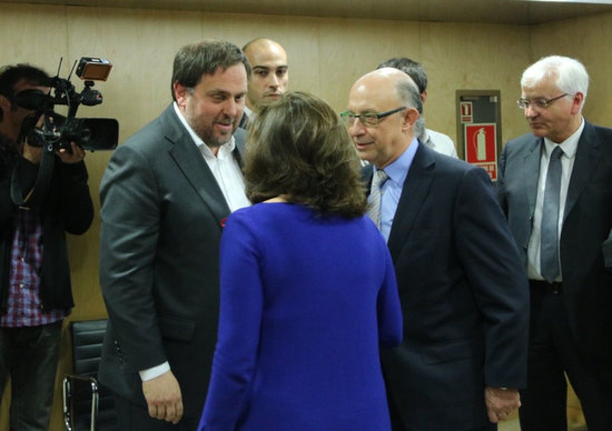 Oriol Junqueras, Cristóbal Montoro i Soraya Sáenz de Santamaría, en una reunió a Madrid.