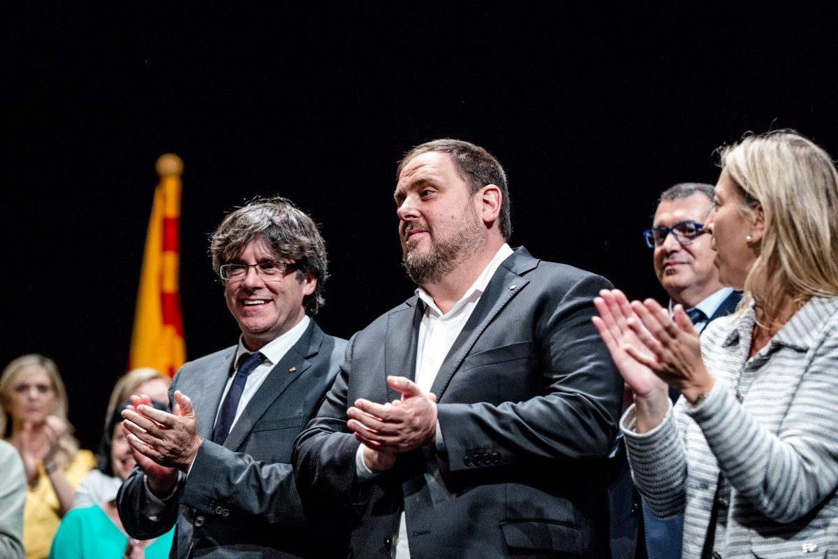 Puigdemont i Junqueras, aplaudint en un acte recent