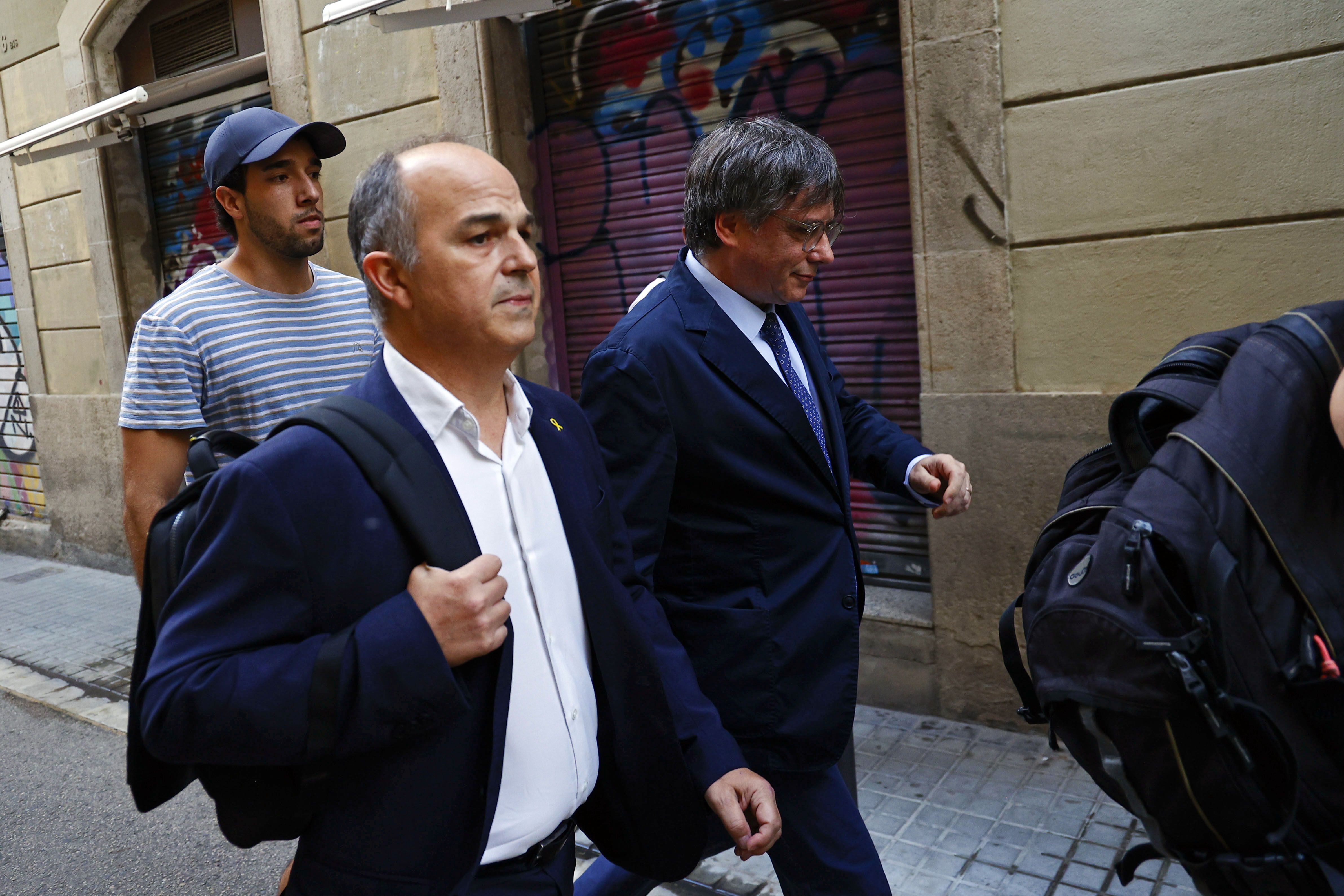 Jordi Turull i Carles Puigdemont, dijous pels carrers de Barcelona.